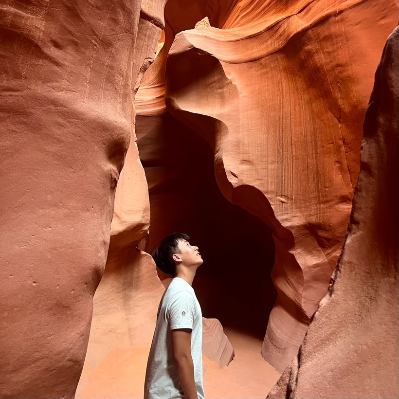 Looking up inside a red sandstone slot canyon